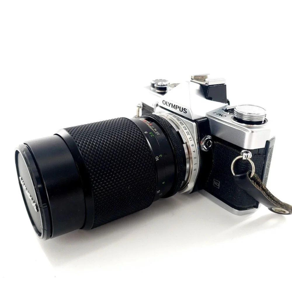 Olympus OM 1 35mm SLR Film Camera with 75-150mm Lens w/ Quantaray 135mm f/2.8